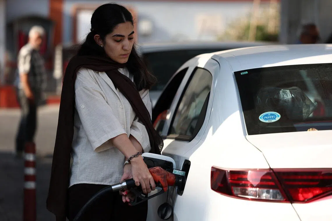 An Iranian woman fills her car, on the verge of the rise in gasoline prices in Iran, at a gas station in Tehran, Iran, September 7, 2026. Majid Asgaripour/WANA (West Asia News Agency) via REUTERS ATTENTION EDITORS - THIS PICTURE WAS PROVIDED BY A THIRD PARTY. ISRAEL OUT. NO COMMERCIAL OR EDITORIAL SALES IN ISRAEL. NO ACCESS FOR ISRAELI MEDIA. NO USE BBC PERSIAN. NO USE VOA PERSIAN. NO USE MANOTO. NO USE IRAN INTERNATIONAL. NO USE RADIO FARDA. DIGITAL: NO USE BBC PERSIAN. NO USE VOA PERSIAN. NO USE MANOTO. NO USE IRAN INTERNATIONAL. NO USE RADIO FARDA.