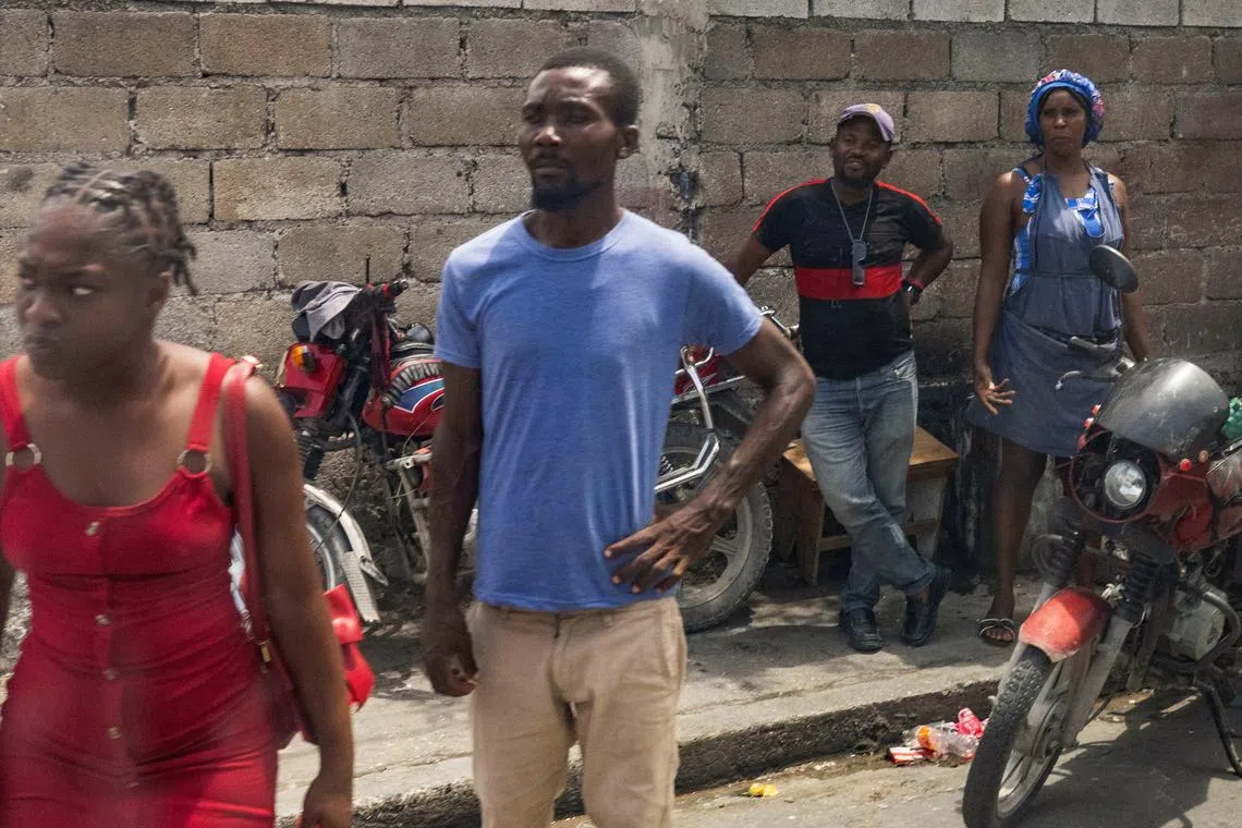 Haitians watch the motorcade of U.S. Secretary of State Antony Blinken travel through Port-au-Prince, Haiti, on September 5, 2024. Roberto Schmidt/Pool via REUTERS
