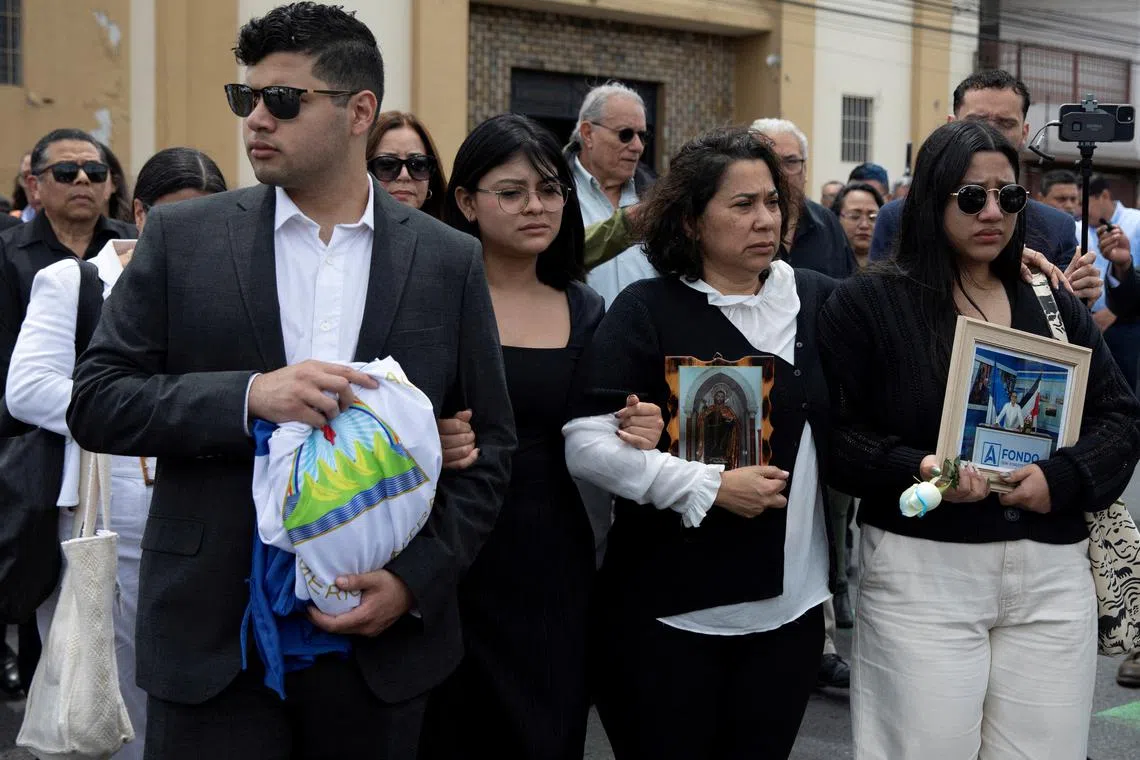 FILE PHOTO: Claudia Vargas and other relatives arrive for the funeral Mass of her husband, exiled former Nicaraguan military officer Roberto Samcam, a retired Sandinista major who was shot to death in his condo on June 19, in San Jose, Costa Rica June 22, 2025. REUTERS/Stringer/File Photo