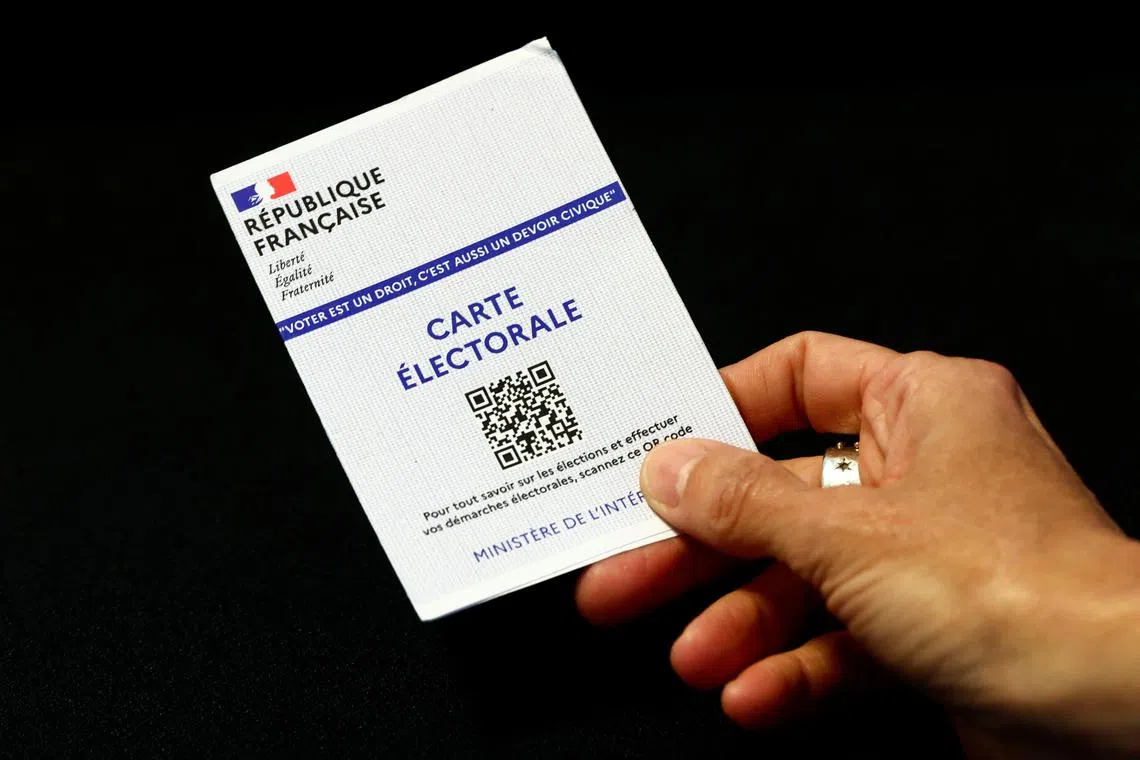 A French voter registration card is seen in this illustration picture taken in Paris, France, June 28, 2024. REUTERS/Gonzalo Fuentes/Illustration