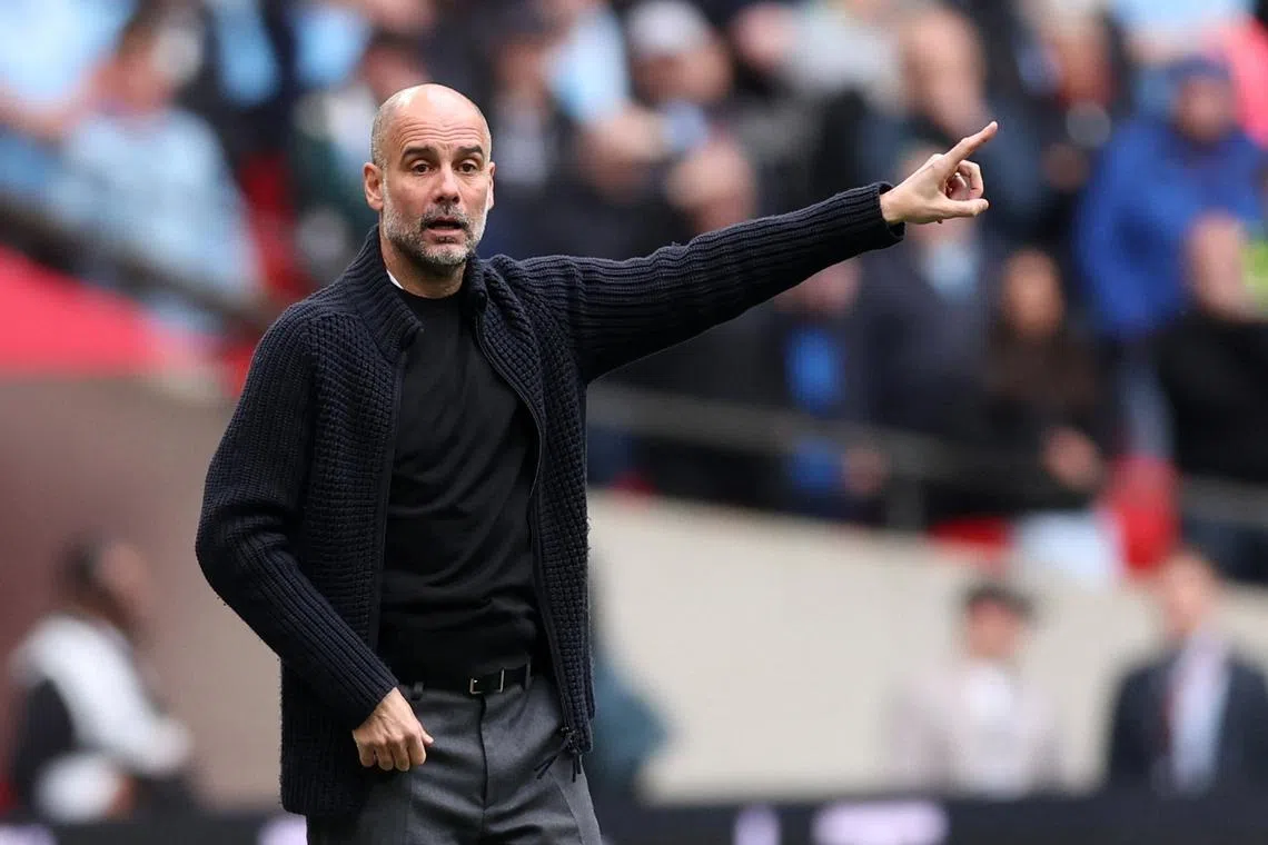 Soccer Football - FA Cup - Semi Final - Manchester City v Chelsea - Wembley Stadium, London, Britain - April 20, 2024  Manchester City manager Pep Guardiola reacts REUTERS/David Klein