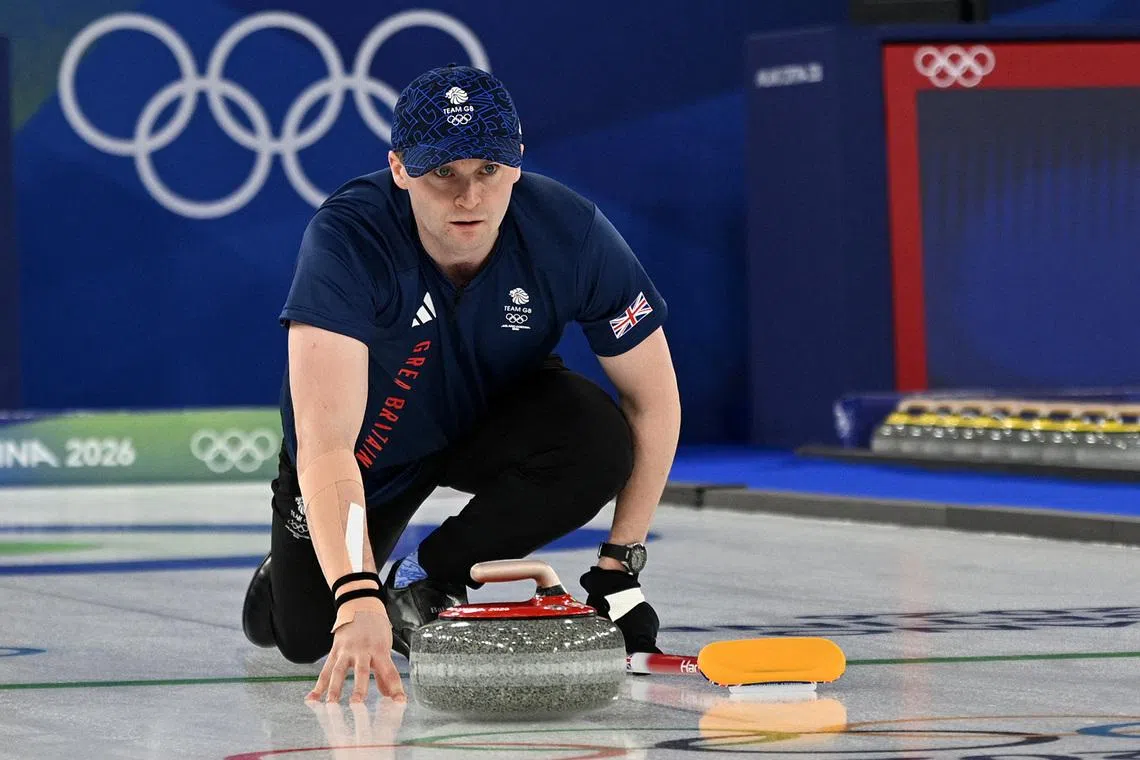 Milano Cortina 2026 Olympics - Curling - Mixed Doubles Bronze Medal Game - Great Britain vs Italy - Cortina Curling Olympic Stadium, Cortina d'Ampezzo, Italy - February 10, 2026. Bruce Mouat of Britain during a match with Jennifer Dodds of Britain against Stefania Constantini of Italy and Amos Mosaner of Italy REUTERS/Jennifer Lorenzini