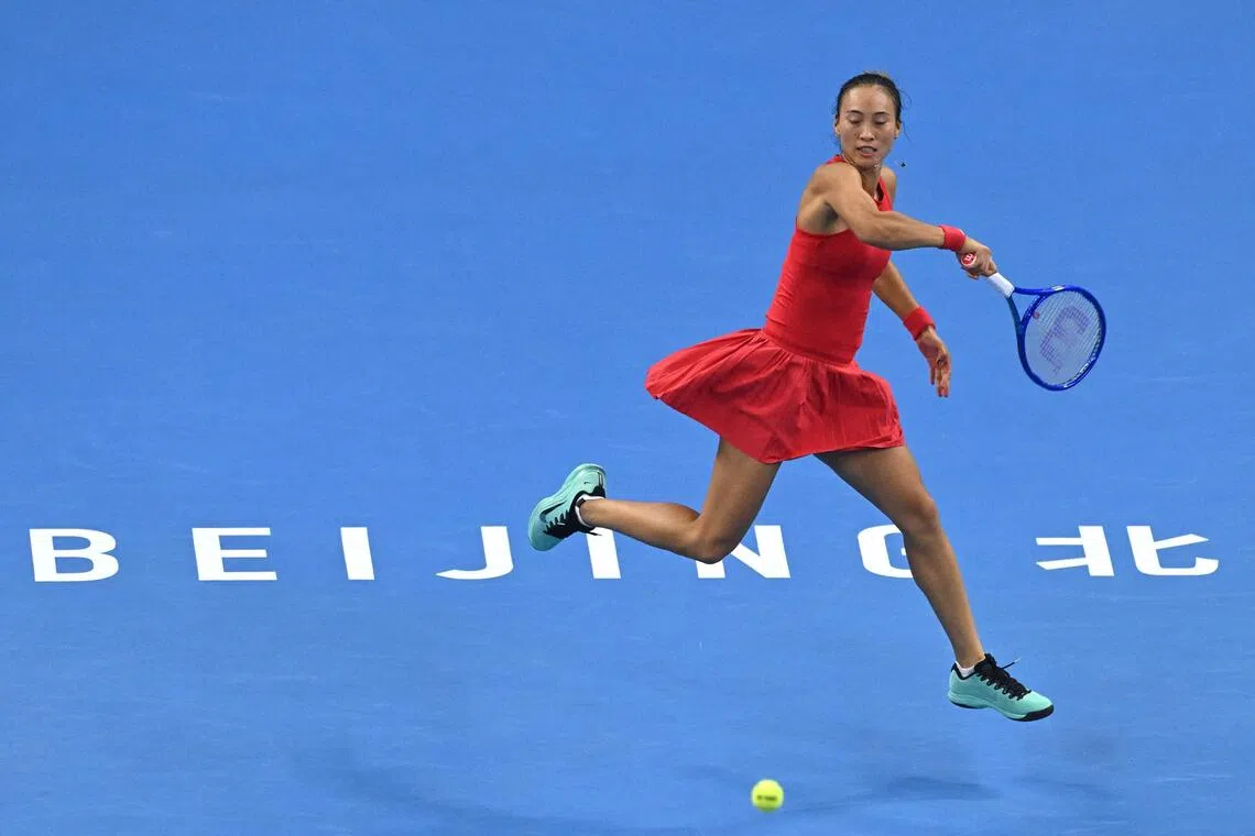 China’s Zheng Qinwen returning to Russia’s Mirra Andreeva during her 7-5, 6-4 win in their women’s singles final at the China Open in Beijing on Oct 11.