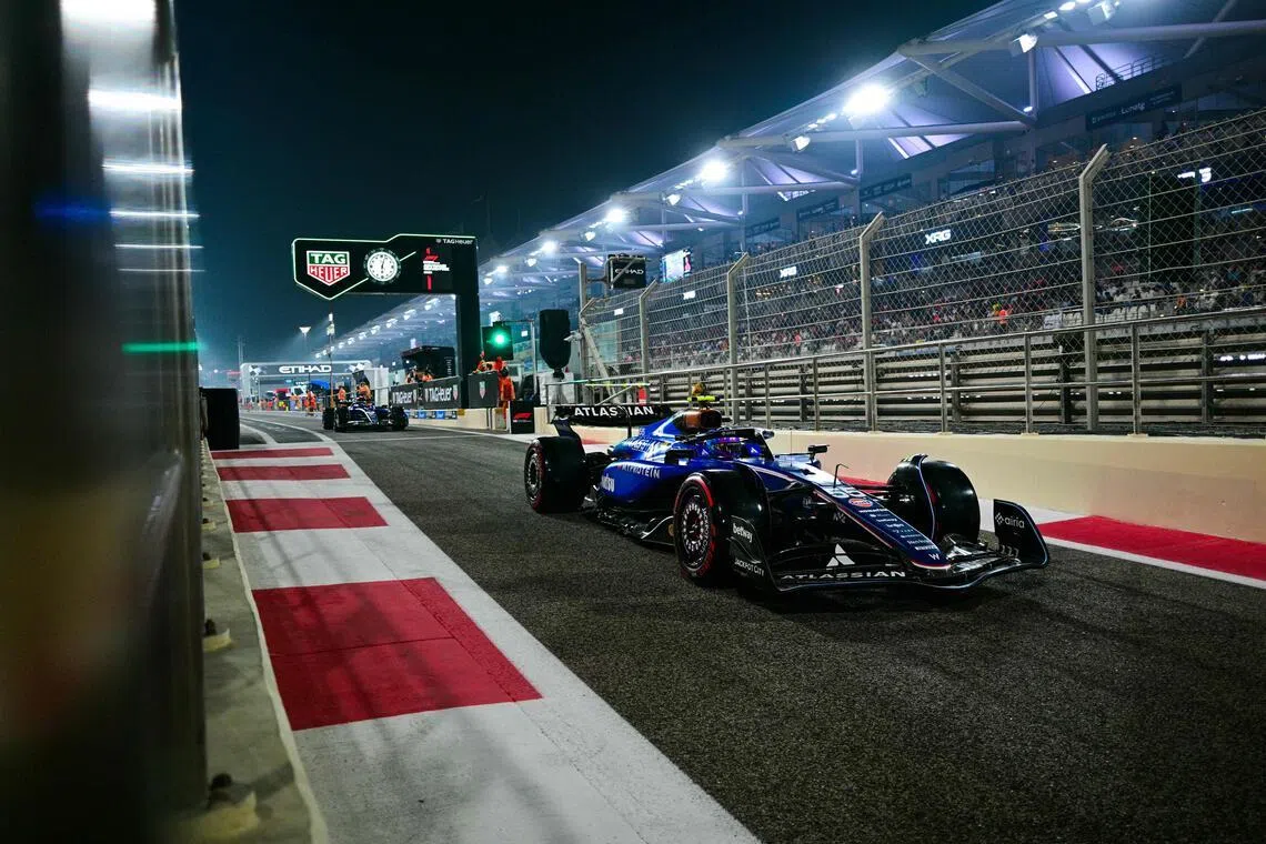 Williams' Carlos Sainz drives out of the pit lane during the qualifying session ahead of the Abu Dhabi Grand Prix at the Yas Marina Circuit on Dec 6, 2025.