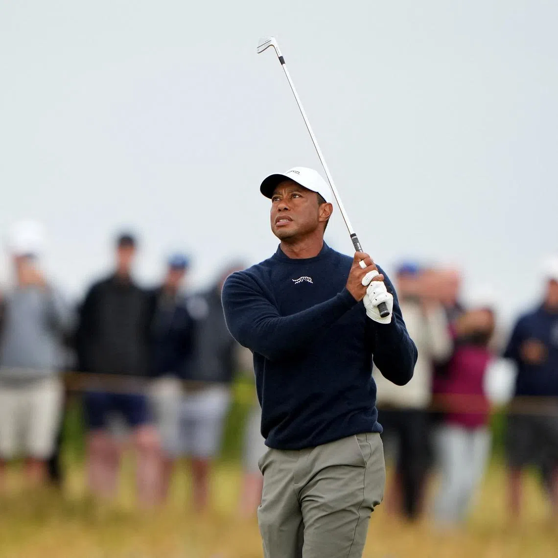 Golf - The 152nd Open Championship - Royal Troon Golf Club, Troon, Scotland, Britain - July 19, 2024 Tiger Woods of the U.S. hits his approach on the 3rd hole during the second round REUTERS/Maja Smiejkowska/ File Photo