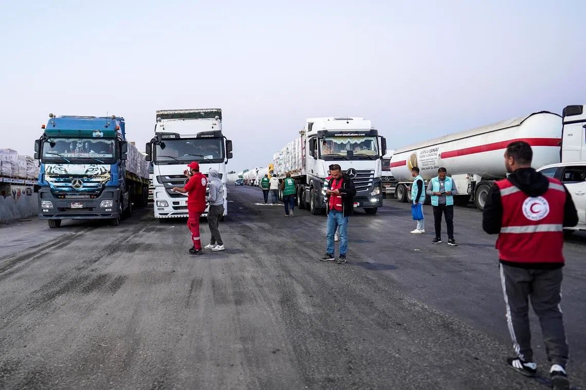 Humanitarian aid trucks queue to enter the Rafah border crossing, between Egypt and the Gaza Strip, on Oct 20.