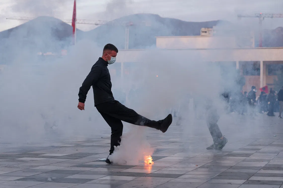 Tear gas, water cannons and rubber bullets were used to disperse protesters in Tirana, Albania, on Oct 24.