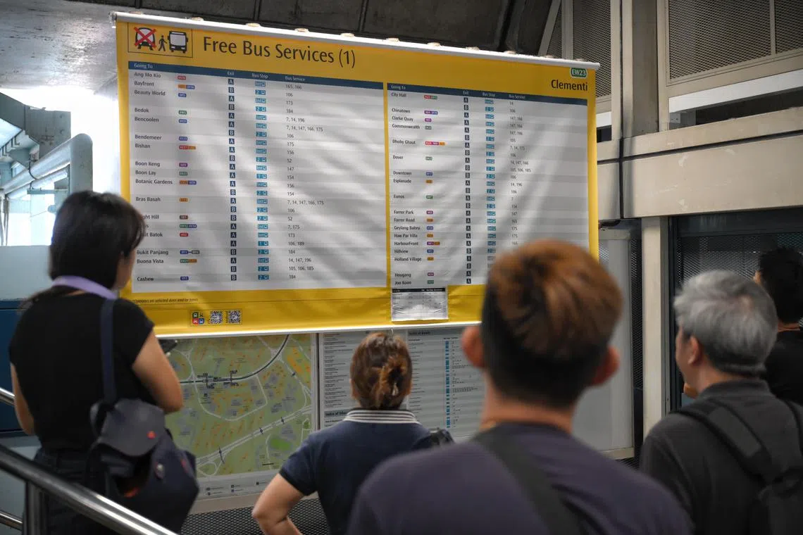 Commuters look at an inform chart of bridging bus services at Clementi MRT station after a train fault between Boon Lay and Queenstown, on Sept 25, 2024.