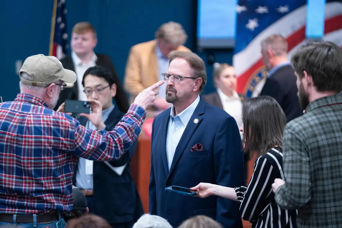 Veteran Sam Bingham (left) points at North Carolina congressman Chuck Edwards at a town hall meeting in Asheville, North Carolina. 