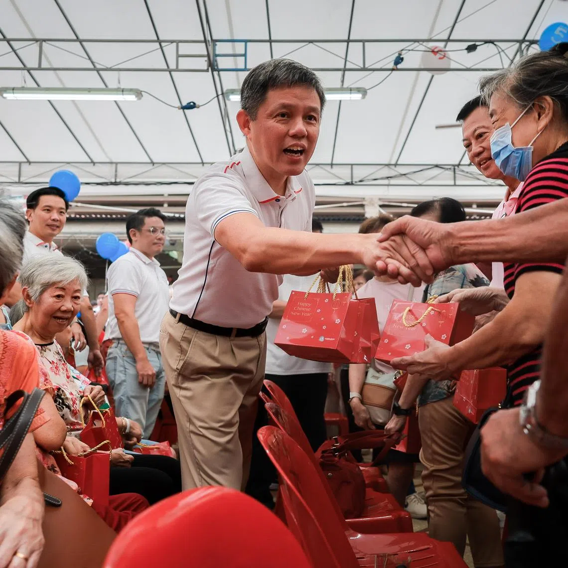 Education Minister Chan Chun Sing distributing oranges to residents at the launch of the new Tanjong Pagar Town 5-year Plan and NRP Completion Ceremony held at Redhill Market and Food Centre on Feb 2, 2025.
