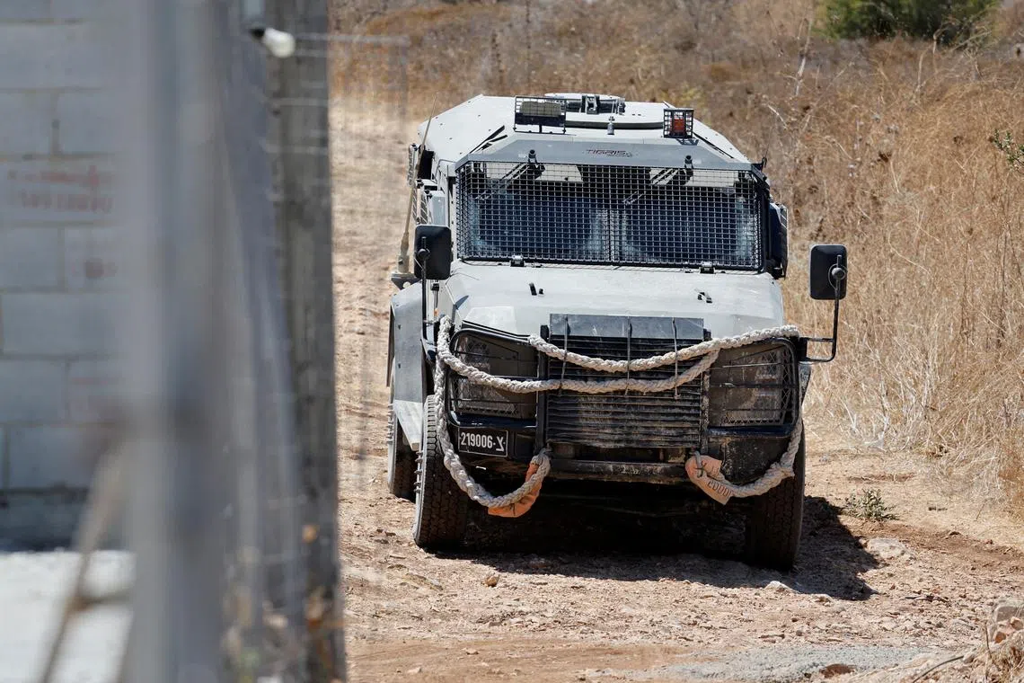 A military vehicle operates during an Israeli raid in Tulkarm, in the Israeli-occupied West Bank, August 3, 2024. REUTERS/Raneen Sawafta