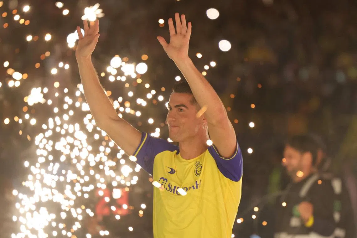 Al-Nassr's new Portuguese forward Cristiano Ronaldo greeting fans during his unveiling at the Mrsool Park Stadium in Riyadh on Jan 3, 2023.