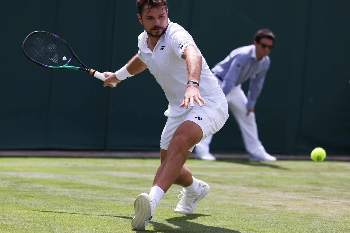 epa10729552 Stan Wawrinka of Switzerland reacts during his Men's Singles 2nd round match against Martin Etcheverry of Argentina at the Wimbledon Championships, Wimbledon, Britain, 06 July 2023.  EPA-EFE/NEIL HALL   EDITORIAL USE ONLY