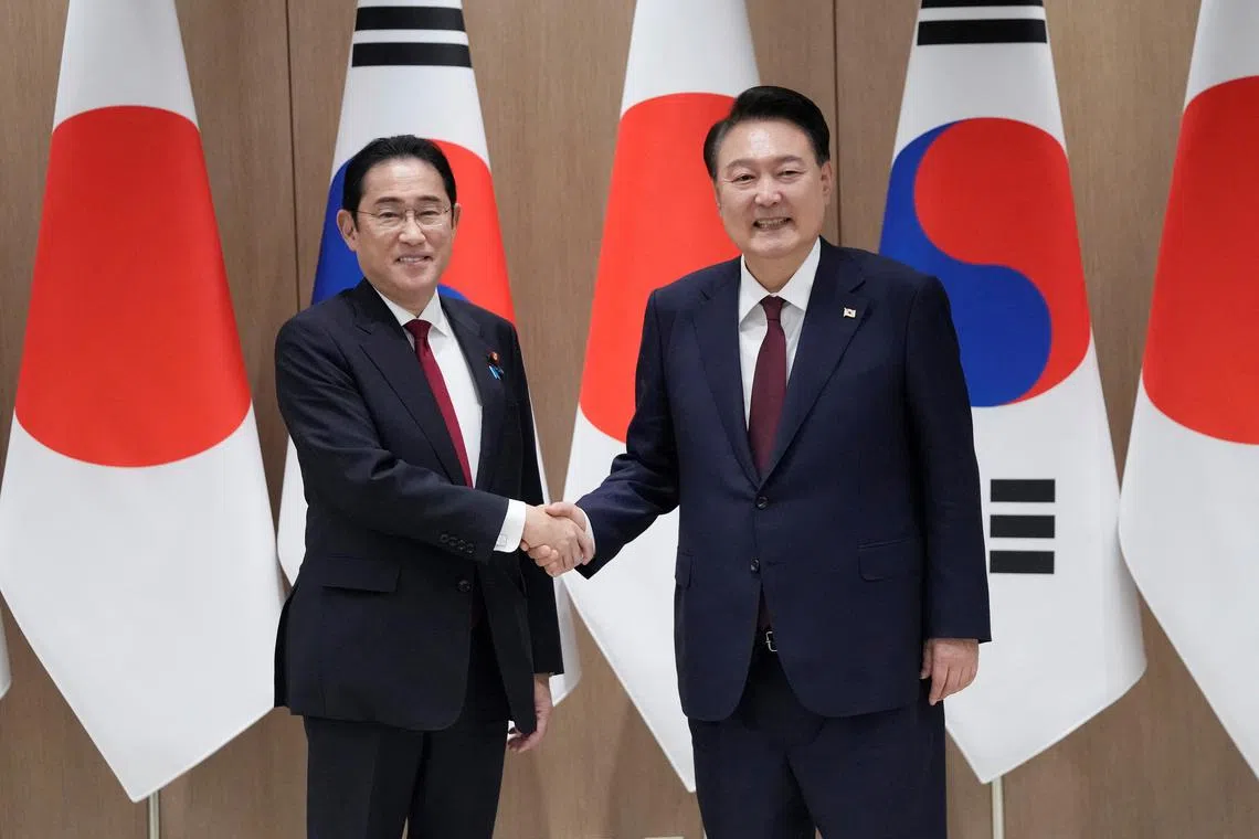FILE PHOTO: South Korean President Yoon Suk Yeol, right, shakes hands with Japanese Prime Minister Fumio Kishida during a meeting at the Presidential Office in Seoul, South Korea, Sunday, May 26, 2024.  Ahn Young-joon/Pool via REUTERS/File Photo