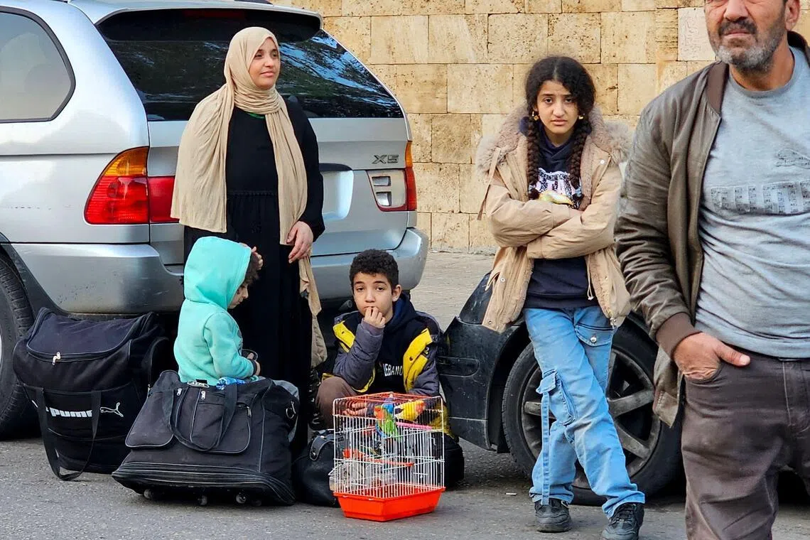 People prepare to flee Beirut’s southern suburbs that Israel has been bombing for days.
