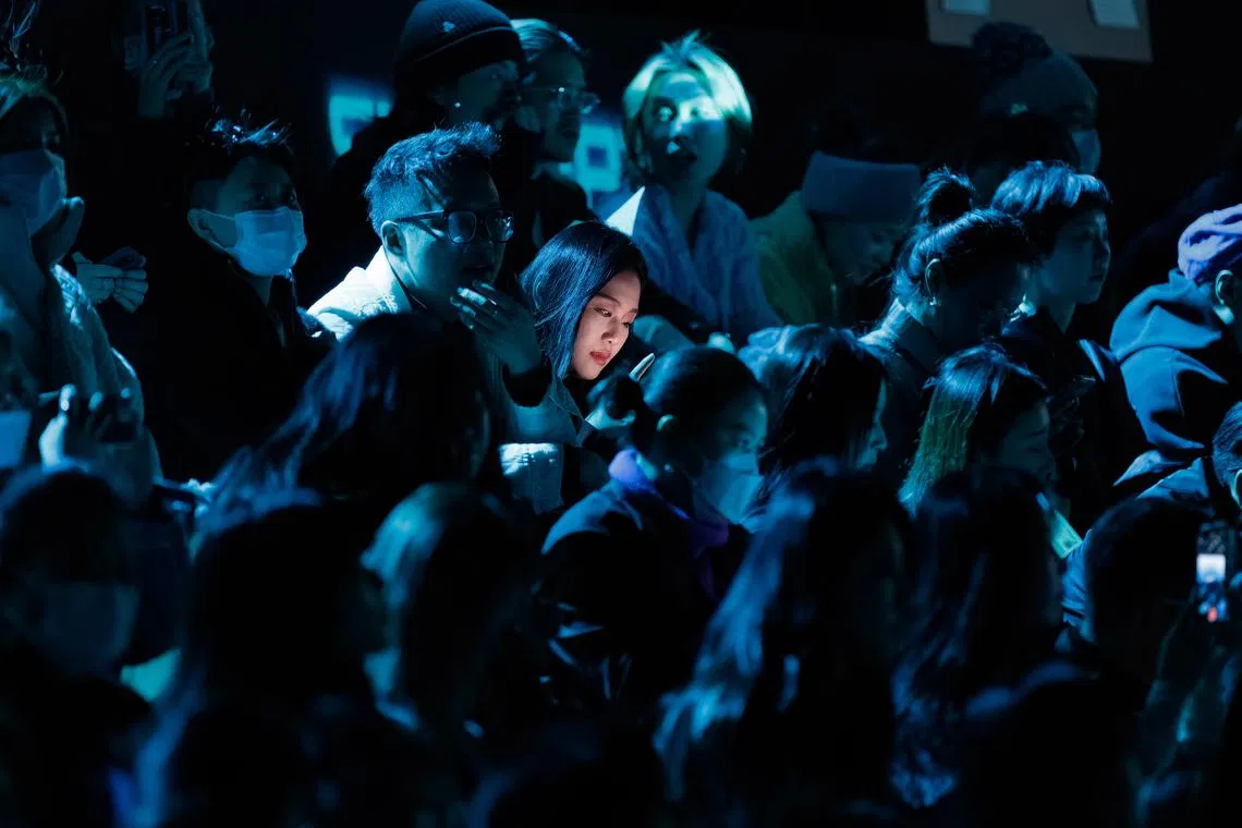 Spectators attending the Staffonly runway presentation during the Shanghai Fashion Week Autumn/Winter 2023 in Shanghai, China, March 30.
