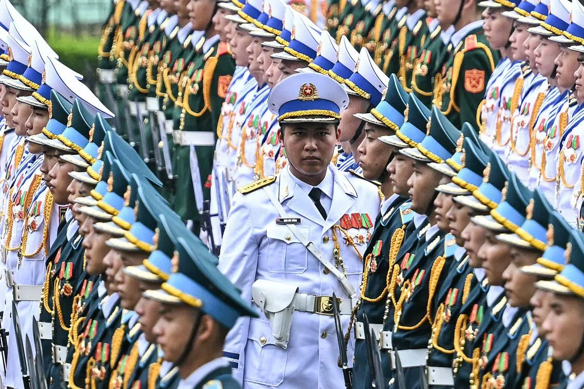 Vietnamese soldiers preparing before the start of a welcome ceremony for Russia's President Vladimir Putin, at the Presidential Palace in Hanoi, on June 20, 2024. 