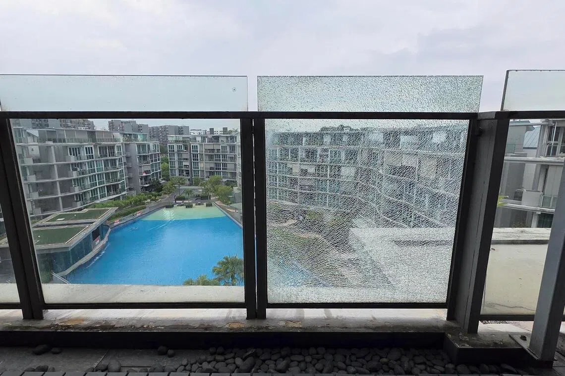 A shattered balcony glass at a penthouse unit in Canberra Residences. Owner Gan S.T. said his balcony glass has been replaced twice, but a panel has shattered again for the third time.