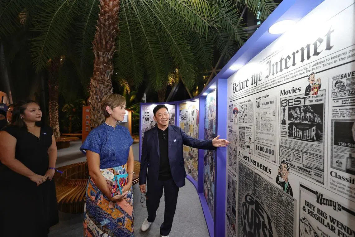 Minister for Digital Development and Information Josephine Teo, accompanied by ST's features editor Wong Kim Hoh and newsroom insights editor Diane Leow, touring Heartbeats And Headlines: 180 Years Of Telling The Singapore Story, an exhibition by ST to mark its 180th anniversary.