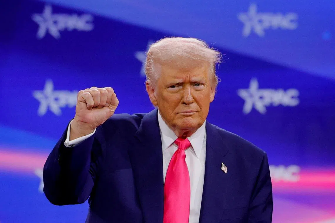 US President Donald Trump gesturing onstage at the Conservative Political Action Conference in the US on Feb 22.