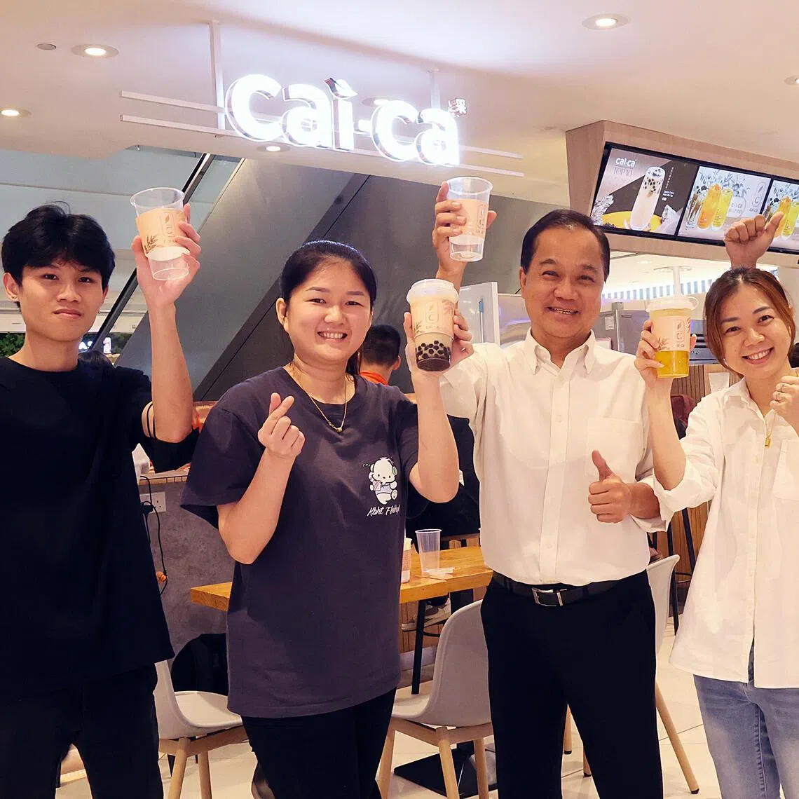 Mr Kang Puay Seng (middle) said he found himself at a crossroads when Gong Cha’s Singapore franchise ended at the end of September.