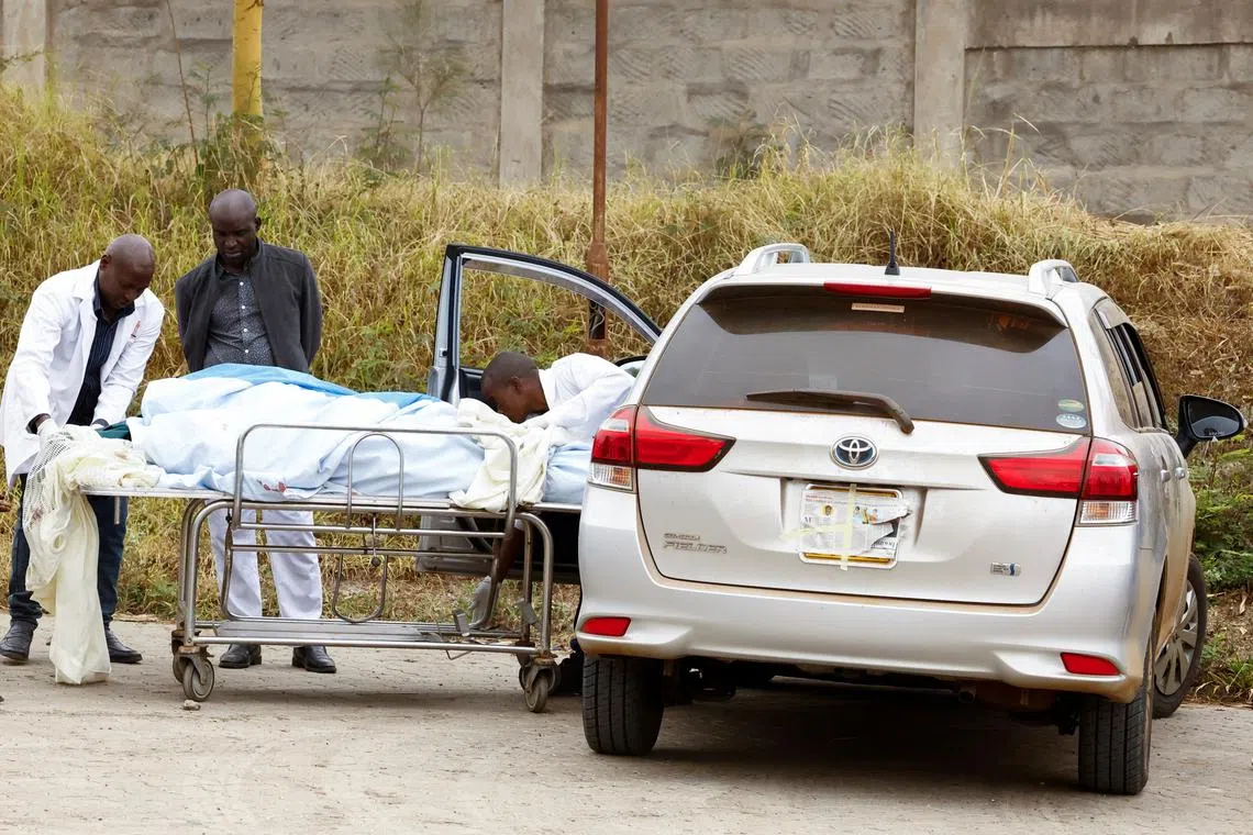 Mortuary staff receive the slain body of Brian Kimutai Bitok, 21, who was shot and killed during anti-government protests, dubbed \"Saba Saba People's March\", at the Kitengela Sub-County Hospital mortuary in Kitengela, Kajiado County, Kenya July 8, 2025. REUTERS/Thomas Mukoya