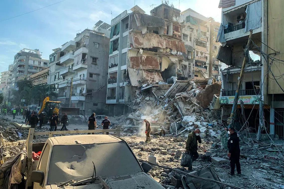 People inspecting the destruction following an Israeli airstrike targeting the Al Ghobeir neighborhood in southern Beirut, Lebanon,  on Nov 14, 2024, amid the ongoing war between Israel and Hezbollah. 