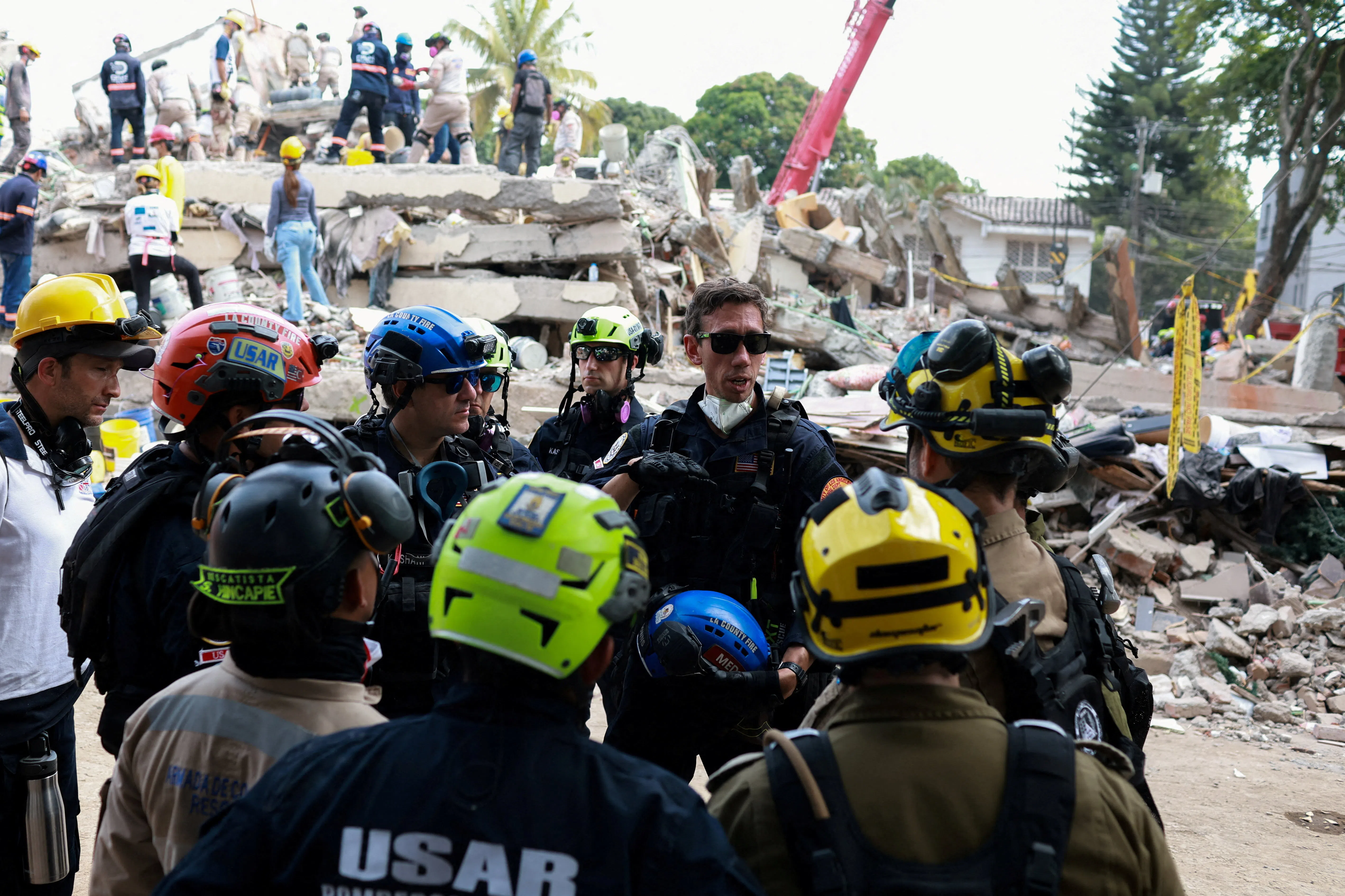 Rescuers team from the US, Israel and Colombia working in the city of Cali on Aug 15.