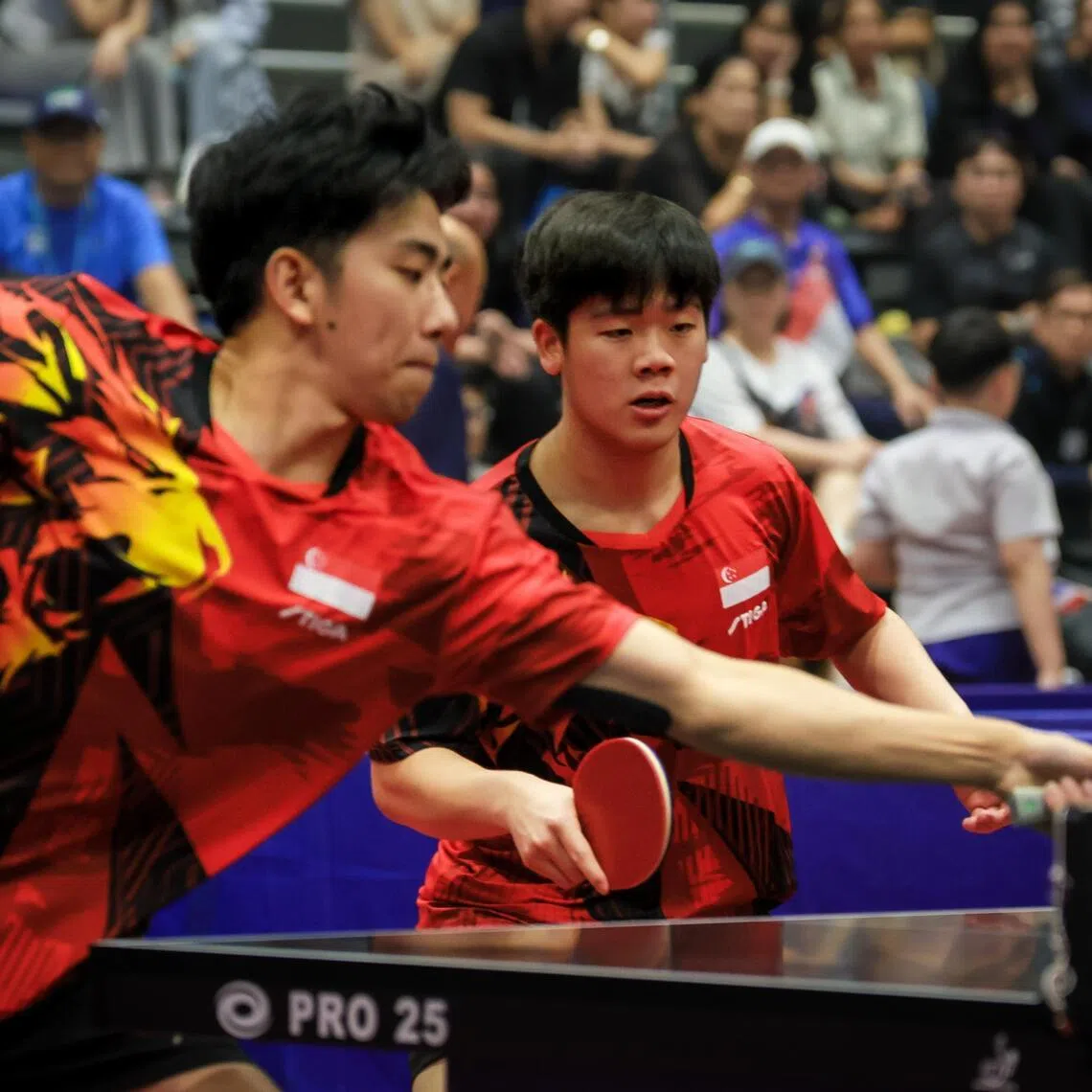 Singapore's Koen Pang (left) and zaac Quek in action during the SEA Games men's doubles final in which they beat Malaysia's Javen Choong and Wong Qi Shen to win gold.