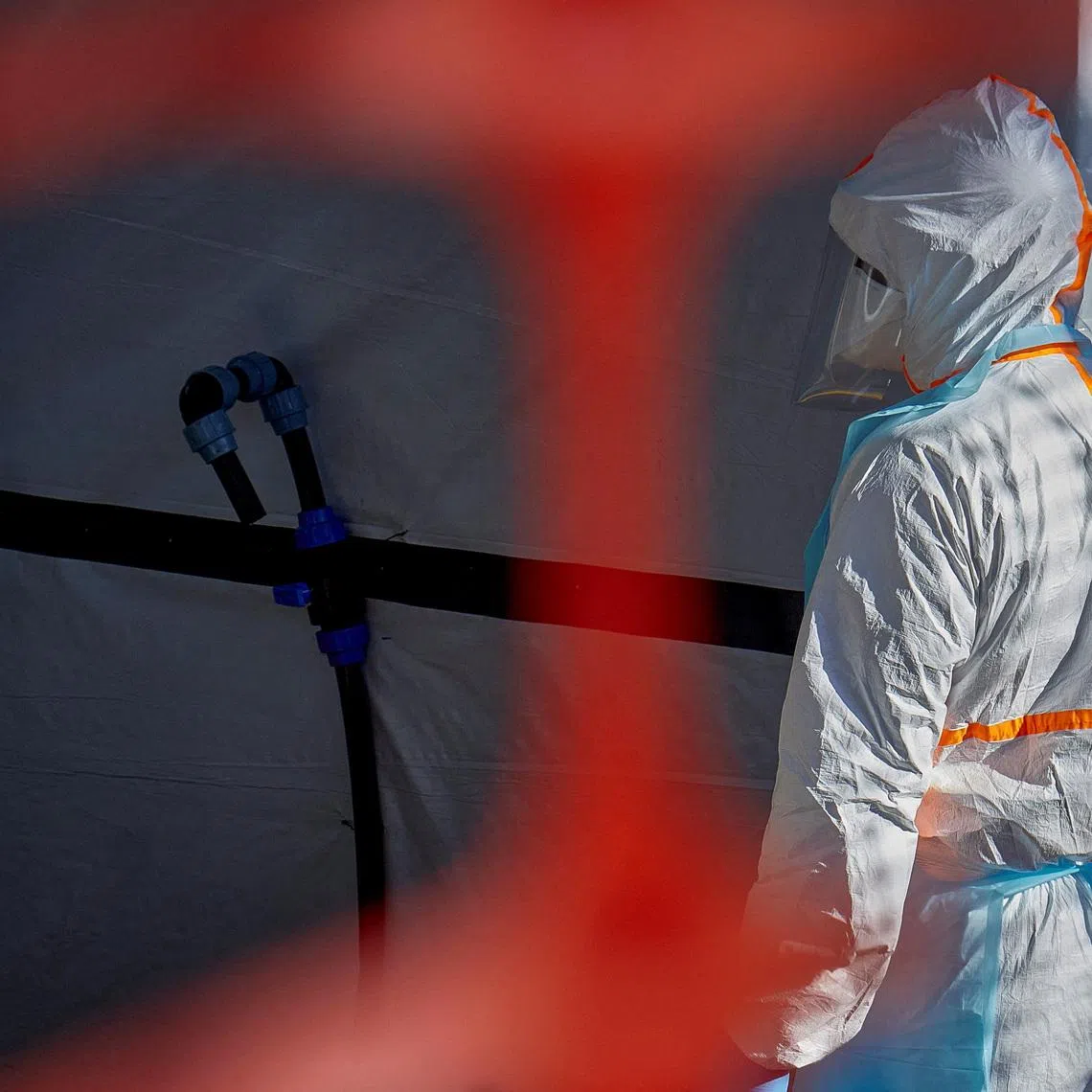 A health worker is dressed up in personal protective equipment (PPE) at the Evangelical Medical Center, one of the facilities at the forefront of the response to the Ebola outbreak, as agencies intensify efforts to contain a new Ebola outbreak caused by the Bundibugyo virus strain, in Bunia, Ituri province, Democratic Republic of Congo, May 31, 2026. REUTERS/Gradel Muyisa Mumbere