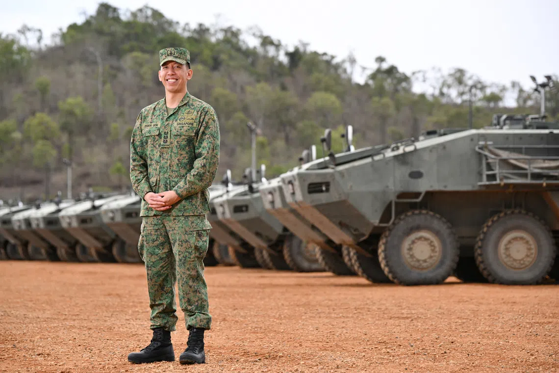 Col Joshua Goh Koon Leong, 35, Exercise Wallaby 2026 Frame 3 Exercise Director, in front of Terrex Infantry Carrier Vehicles at Camp Tilpal in the Shoalwater Bay Training Area in Queensland, Australia on Oct 22.