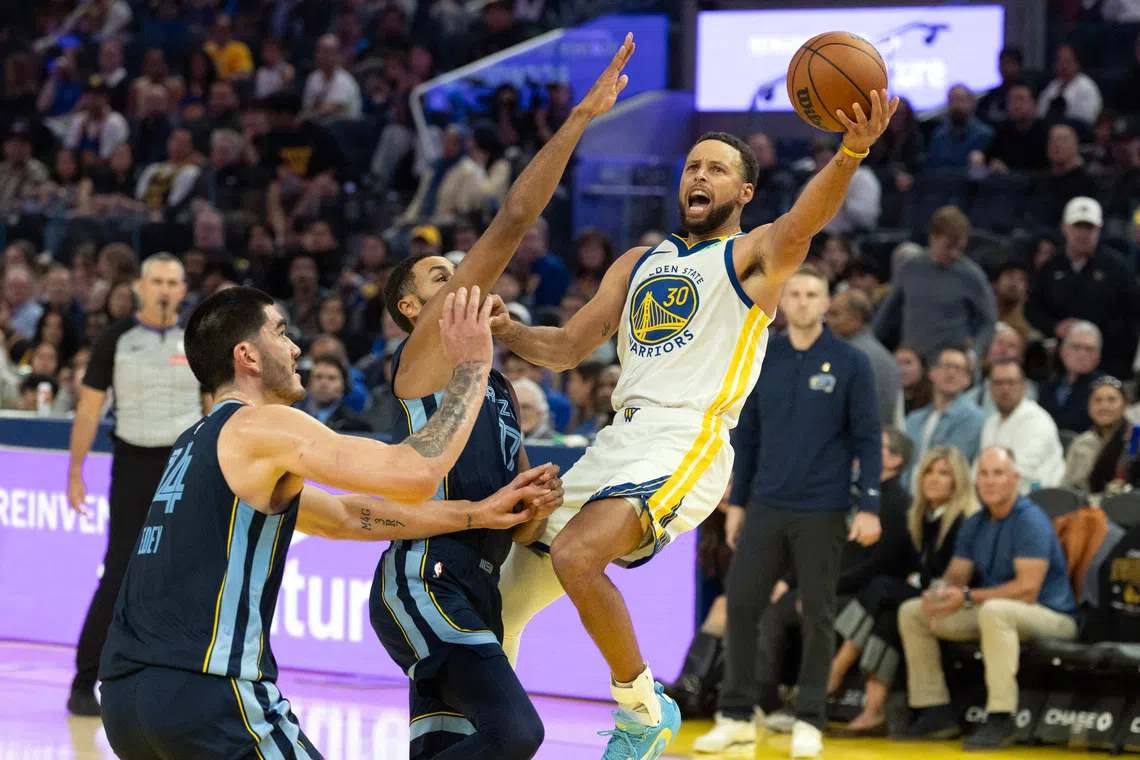Golden State Warriors guard Stephen Curry attempts a lay-up.