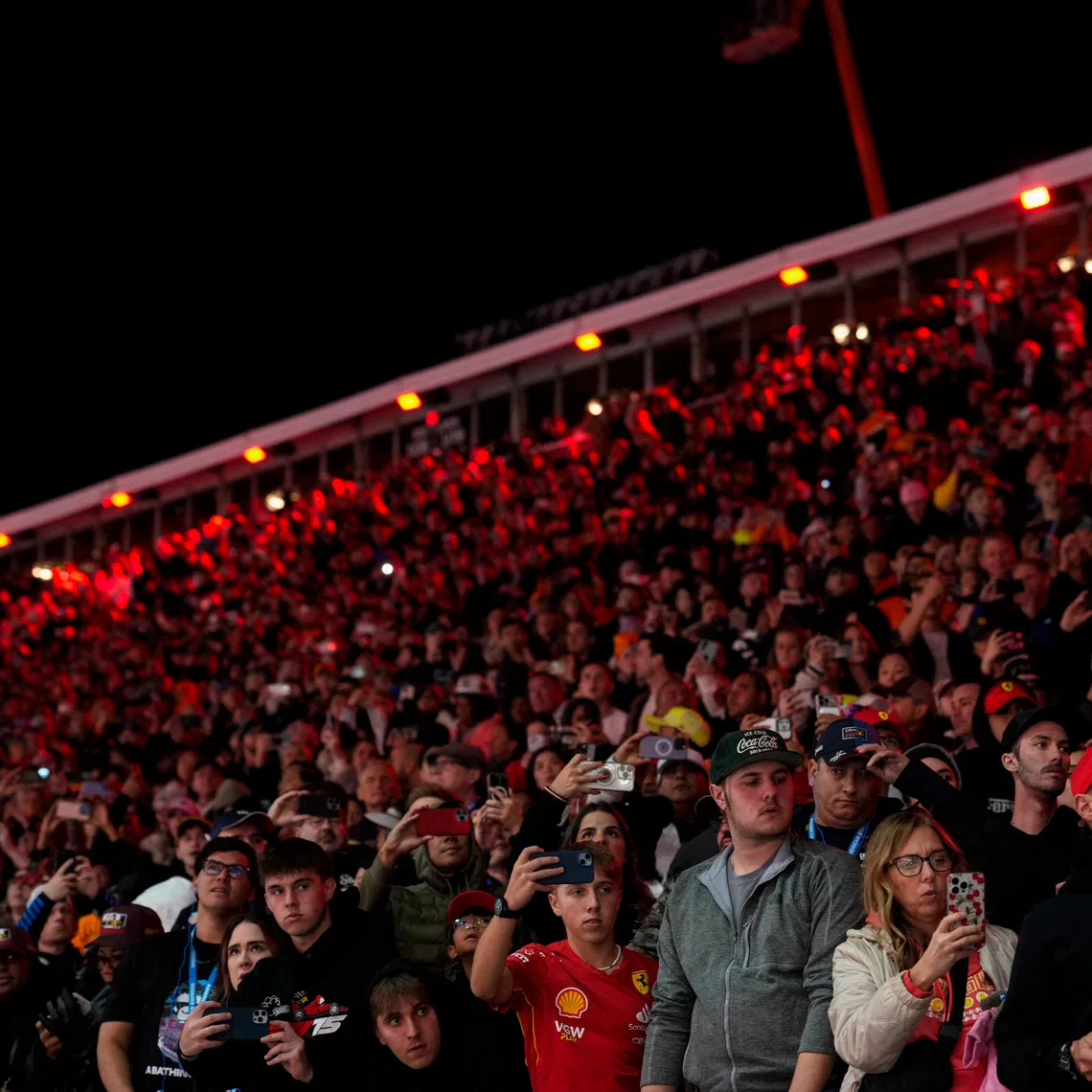 Nov 22, 2025; Las Vegas, NV, USA; Fans watch from the stands during the Las Vegas Grand Prix at the Las Vegas Strip Circuit. Mandatory Credit: Lucas Peltier-Imagn Images