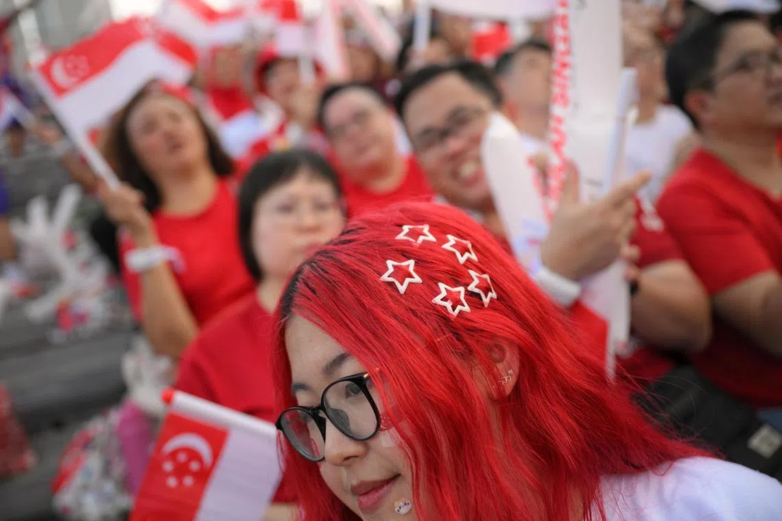 Julia Moe, 18, a Singapore Polytechnic student, sporting a customised hairstyle during the National Day Parade. 

