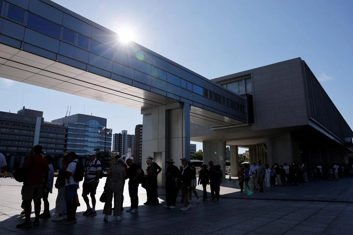 People line up to enter the Hiroshima Peace Memorial Museum.