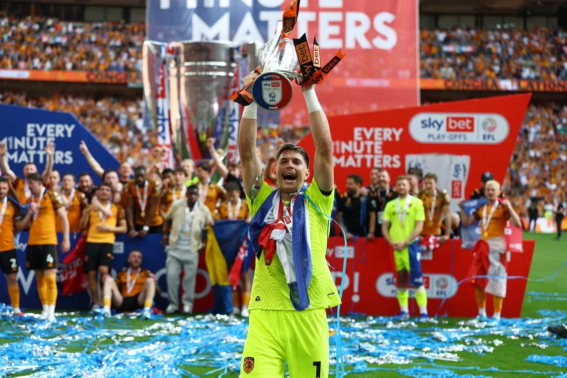 Soccer Football - Championship - Play Off - Final - Hull City v Middlesbrough - Wembley Stadium, London, Britain - May 23, 2026 Hull City's Ivor Pandur holds aloft the trophy as they celebrate winning the Championship Playoff Final Action Images via Reuters/Matthew Childs