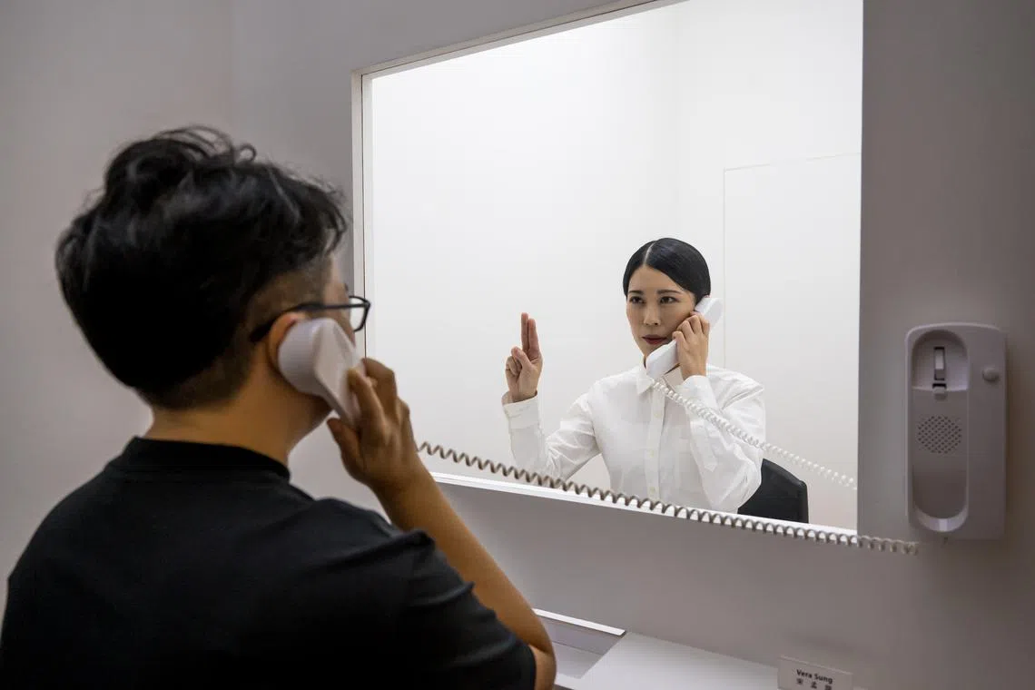 Taiwanese artist Joyce Ho plays a museum guide on Tuesday, May 23, explaining what each subsequent day/room will be.