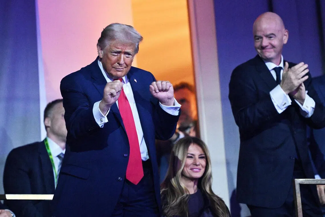 (From left) US President Donald Trump, Us First Lady Melania Trump and FIFA president Gianni Infantino watch the Village People perform during the World Cup 2026 draw.