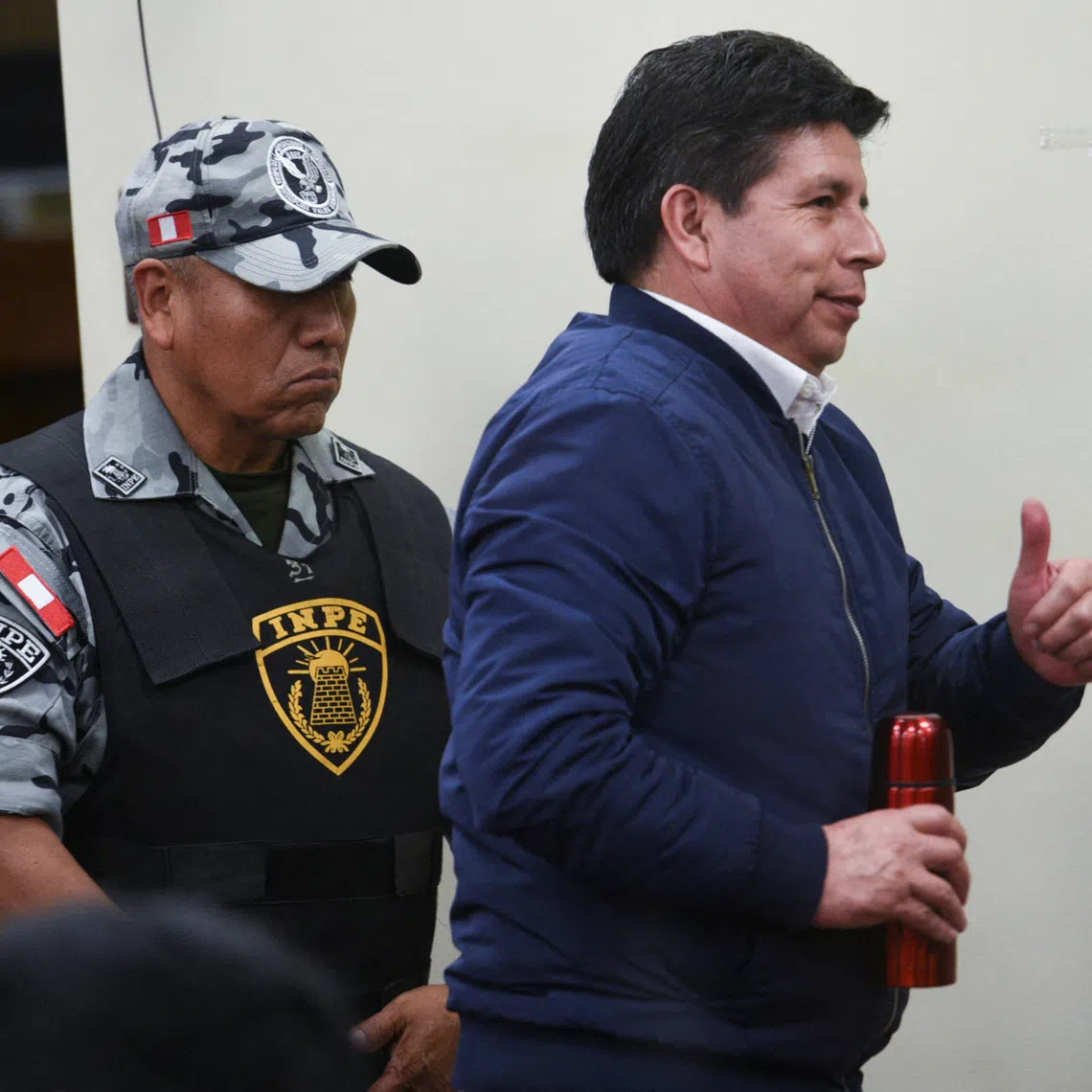 Peru’s former leftist President Pedro Castillo gestures at a court hearing during his trial for rebellion and conspiracy against the state, following his failed attempt to dissolve Congress and assume broad powers in late 2022, in Lima, Peru, November 27, 2025. REUTERS/Luis Julian