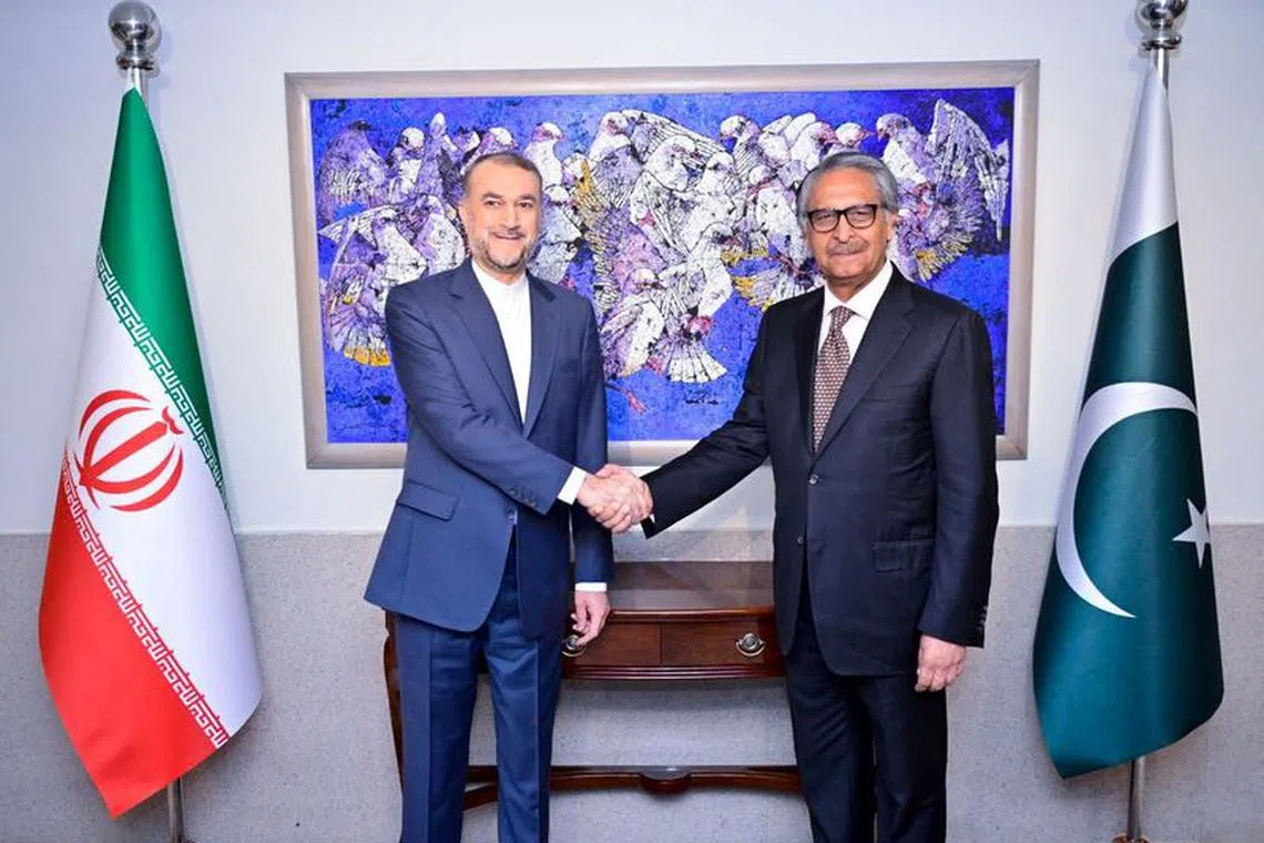Pakistan's caretaker Foreign Minister Jalil Jilani shakes hands with Iran's Foreign Minister Hossein Amir-Abdollahian in Islamabad, Pakistan, January 29, 2024. Pakistan Ministry of Foreign Affairs/Handout via REUTERS