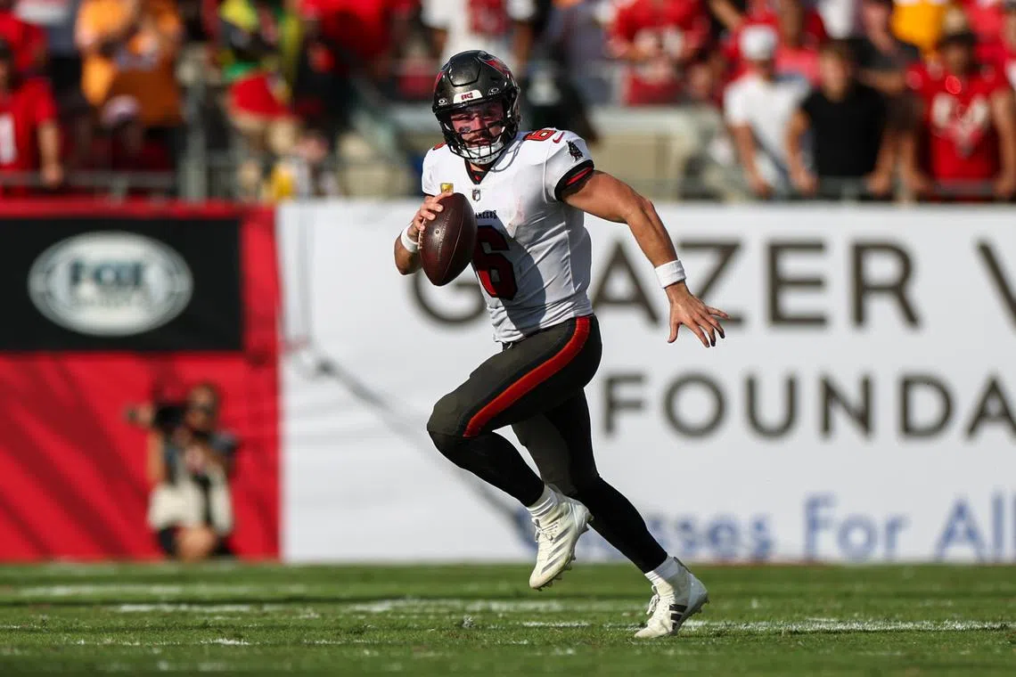 FILE PHOTO: Nov 10, 2024; Tampa, Florida, USA; Tampa Bay Buccaneers quarterback Baker Mayfield (6) runs with the ball against the San Francisco 49ers in the fourth quarter at Raymond James Stadium. Mandatory Credit: Nathan Ray Seebeck-Imagn Images/File Photo