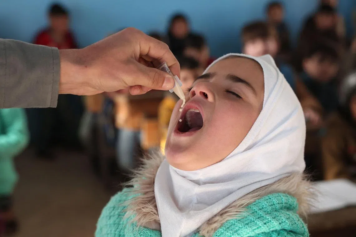A child in Syria taking a dose of the cholera vaccine. Syria is one of 11 countries deemed to be facing an "acute crisis" dealing with the pandemic, said the UN.