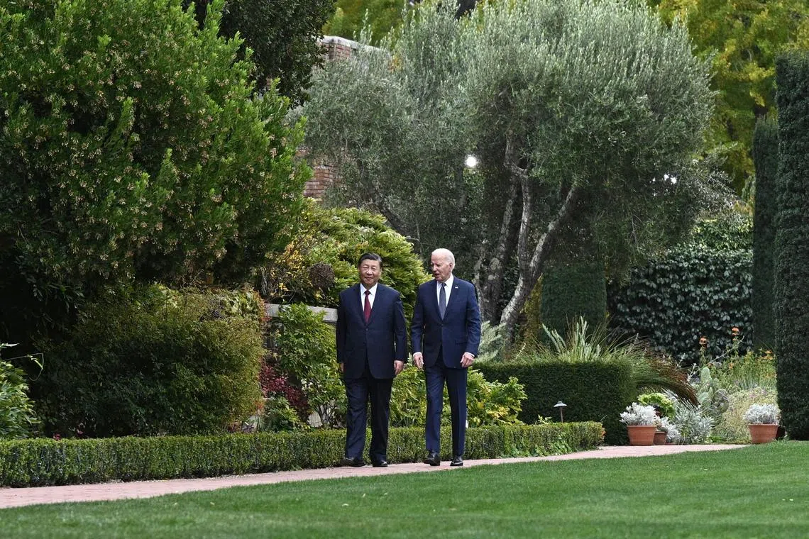 Chinese President Xi Jinping and his US counterpart Joe Biden taking a walk after their meeting in Woodside, California, on Nov 15.