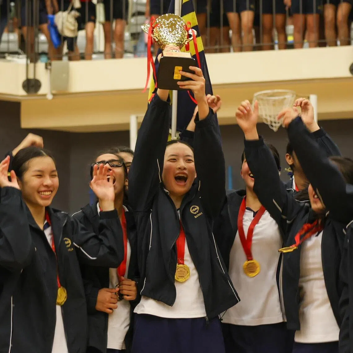 MGS Netball Captain Sarah Lim lifting the trophy after winning the National School Games B Division Girls netball finals held at Singapore Sports School on April 24, 2026.