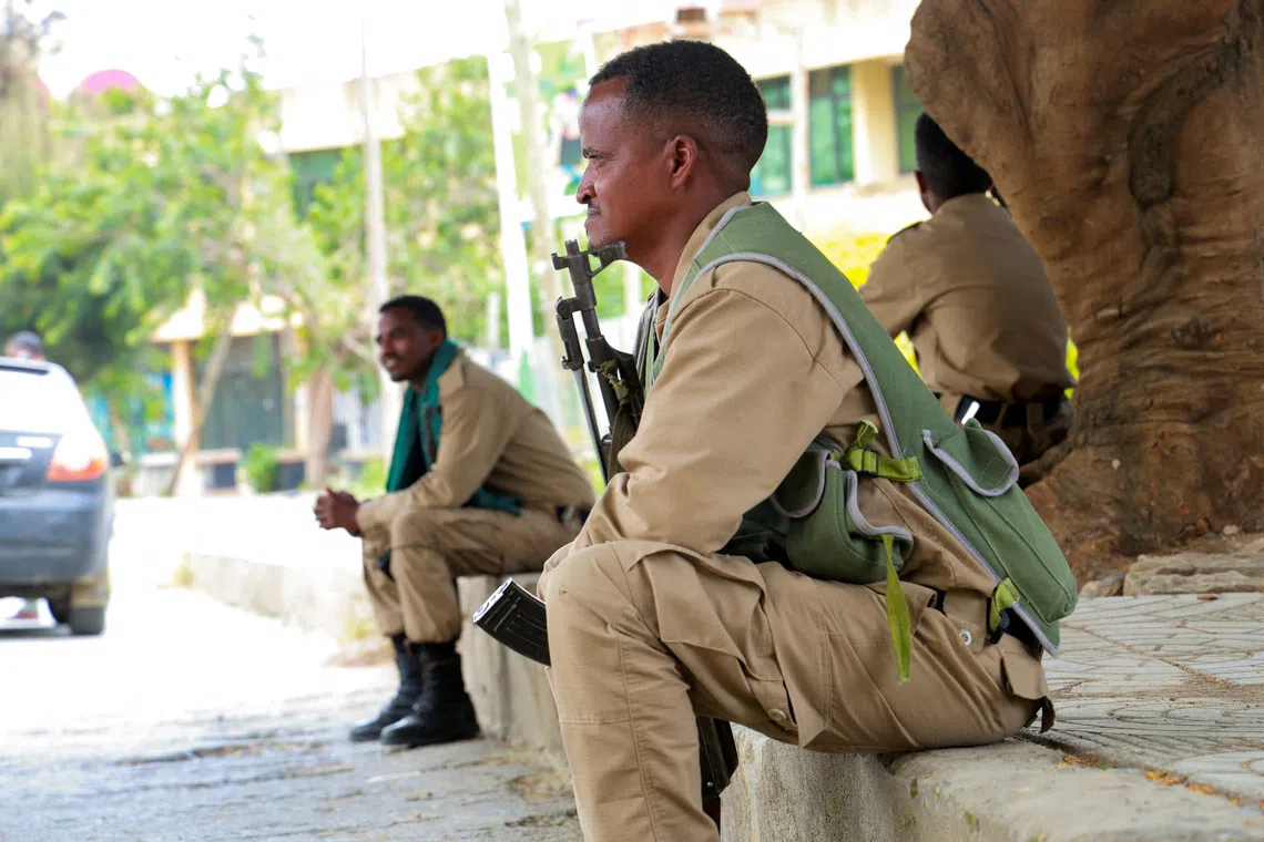Members of the Tigrayan forces sit along a street as they patrol as tensions intensify after the forces launched a major offensive against the federal government in multiple locations, in Mekelle, Tigray Region, Ethiopia, September 24, 2026. Obtained by REUTERS