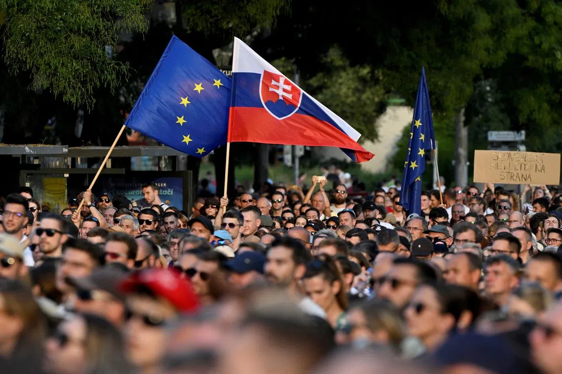 FILE PHOTO: Demonstrators attend an anti-government protest against recent moves by the government on justice and cultural issues, in Bratislava, Slovakia, August 13, 2024.  REUTERS/Radovan Stoklasa/File Photo