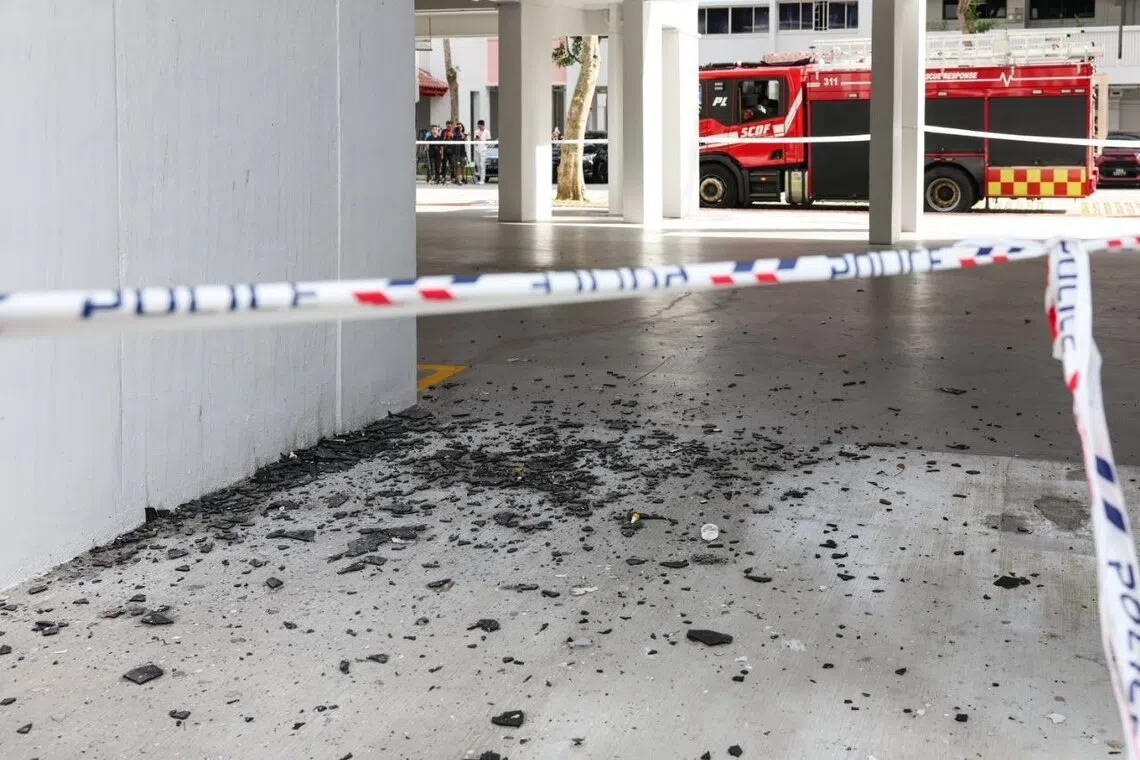 Debris on the ground floor of Block 128 Yishun Street 11, where the fire broke out.