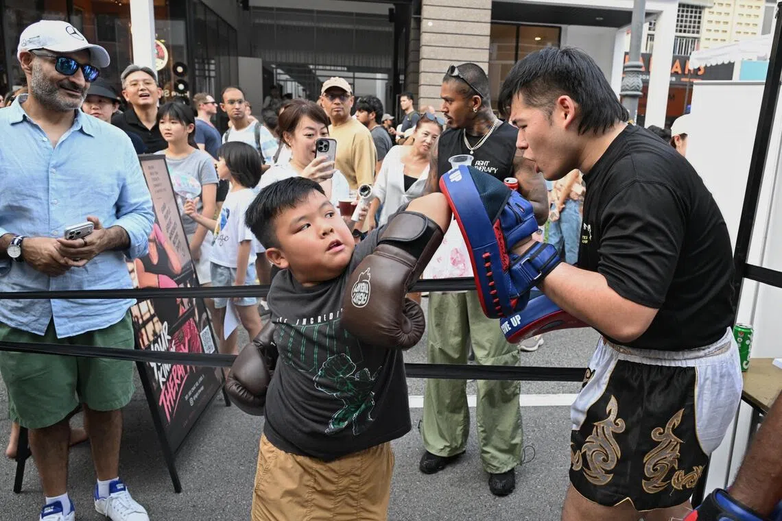 Children trying their hands at Muay Thai on the streets at the Joo Chiat Car-Free Day on Oct 3.