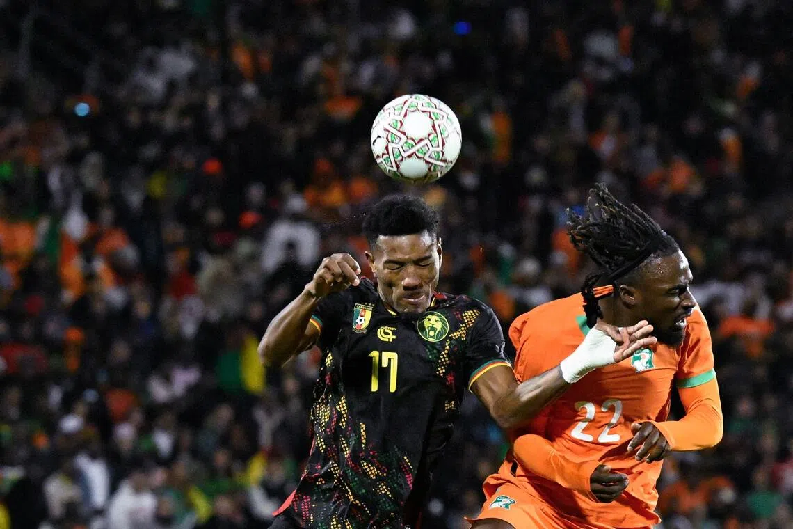 Cameroon defender Samuel Kotto is challenged by Ivory Coast forward Sebastien Haller in their Africa Cup of Nations Group F football match at Marrakesh Stadium, Morocco on Dec 28, 2025.