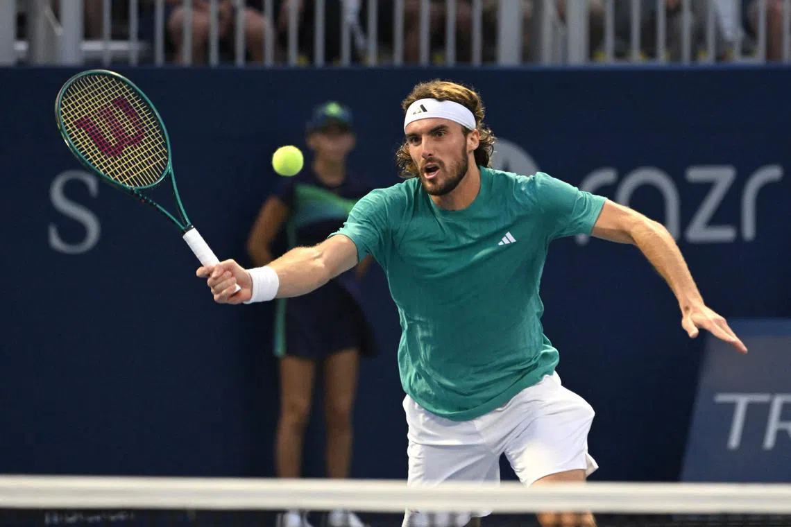 Jul 30, 2025; Toronto, ON, Canada;  Stefanos Tsitsipas (GRE) plays a shot against Christopher O'Connell (AUS) during second round play at Sobeys Stadium. Mandatory Credit: Dan Hamilton-Imagn Images
